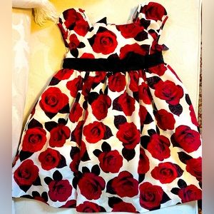 Dress- Festive holiday dress. Like new. Red flowers with black bow. 2 T